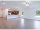 Spacious living room with tile flooring and a ceiling fan at 141 Hobo Rd, Rotonda West, FL 33947