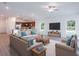 Open living room with a cozy seating area and large windows at 141 Hobo Rd, Rotonda West, FL 33947