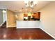 Dining area with hardwood floors and a view of the kitchen at 20046 Satin Leaf Ave, Tampa, FL 33647