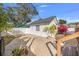 Backyard with brick patio, deck, and lush plants at 2747 3Rd N Ave, St Petersburg, FL 33713