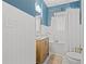 Bathroom with a clawfoot tub, wood vanity, and white subway tile at 2747 3Rd N Ave, St Petersburg, FL 33713
