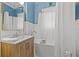 Light and bright bathroom with a clawfoot tub and wood vanity at 2747 3Rd N Ave, St Petersburg, FL 33713