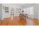 Bright dining room features hardwood floors, built-in shelving, and view into kitchen at 2747 3Rd N Ave, St Petersburg, FL 33713
