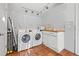 Laundry room with washer, dryer, and white cabinets at 2747 3Rd N Ave, St Petersburg, FL 33713