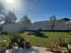 Large backyard with a shed, fence, and plenty of green space at 3818 Beechwood Dr, Holiday, FL 34691