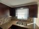Kitchen features double sink and granite counters at 3818 Beechwood Dr, Holiday, FL 34691