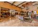 Elegant community room with seating areas, a bar, and high ceilings at 4166 Central Sarasota Pkwy # 521, Sarasota, FL 34238