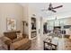 Spacious living room with seating area and home office space at 4166 Central Sarasota Pkwy # 521, Sarasota, FL 34238