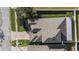 Aerial shot displays the house, roofline, manicured landscaping, and surrounding neighborhood at 4205 Morning Breeze Ct, Tampa, FL 33619