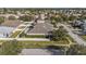 Aerial view showcases the home's spacious backyard, white fence, and landscaping at 4205 Morning Breeze Ct, Tampa, FL 33619