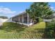 Relaxing screened lanai offers a tranquil outdoor space, complemented by the privacy fence at 4205 Morning Breeze Ct, Tampa, FL 33619