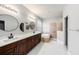Primary bathroom featuring double vanity sinks, garden tub, and a separate shower at 4205 Morning Breeze Ct, Tampa, FL 33619