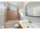 Bathroom featuring a shower-tub combination with tile surround and a vanity with sink at 4205 Morning Breeze Ct, Tampa, FL 33619