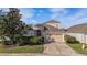 Charming home with a well-manicured lawn and a two-car garage at 4205 Morning Breeze Ct, Tampa, FL 33619