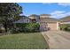 Attractive home with manicured landscaping and two car garage at 4205 Morning Breeze Ct, Tampa, FL 33619
