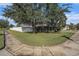 Well-manicured lawn and landscaping frame this corner lot home, showcasing a welcoming entrance at 4205 Morning Breeze Ct, Tampa, FL 33619