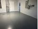 Spacious garage with an epoxy floor and plenty of room for storage or a workshop at 4205 Morning Breeze Ct, Tampa, FL 33619