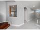 Hallway with tile floor that provides a view to the front door and kitchen at 4205 Morning Breeze Ct, Tampa, FL 33619