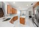 Bright kitchen with white countertops, wood cabinets, and stainless steel appliances at 4205 Morning Breeze Ct, Tampa, FL 33619