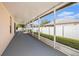 Enclosed lanai showcasing the views of the backyard and providing a covered outdoor space at 4205 Morning Breeze Ct, Tampa, FL 33619