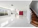 Spacious living room featuring lots of open floor space, stairs, and abundant natural light at 4205 Morning Breeze Ct, Tampa, FL 33619