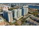 Aerial view of high-rise apartments, pool, and surrounding urban area at 450 Knights Run Ave # 1102, Tampa, FL 33602