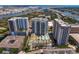 High-rise residential buildings with a pool, landscaping, and nearby amenities at 450 Knights Run Ave # 1102, Tampa, FL 33602