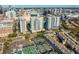 City view of high-rise with nearby tennis courts, showcasing urban lifestyle at 450 Knights Run Ave # 1102, Tampa, FL 33602
