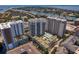 Modern apartment complex with a pool, surrounding buildings, and landscaping at 450 Knights Run Ave # 1102, Tampa, FL 33602