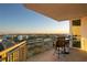 Balcony with seating overlooking a cityscape and tennis courts at 450 Knights Run Ave # 1102, Tampa, FL 33602