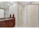 Modern bathroom with a granite countertop, single vanity, and glass shower at 450 Knights Run Ave # 1102, Tampa, FL 33602
