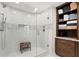 Large walk-in shower with a bench, mosaic tile accent, and ample storage at 450 Knights Run Ave # 1102, Tampa, FL 33602