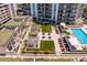 Outdoor community area with lawn, seating, and a pool at 450 Knights Run Ave # 1102, Tampa, FL 33602