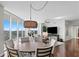 Spacious dining area with a round table and access to the living space and balcony at 450 Knights Run Ave # 1102, Tampa, FL 33602