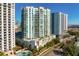 Exterior view of a modern high-rise building with balconies and landscaping at 450 Knights Run Ave # 1102, Tampa, FL 33602