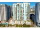 Aerial view of a modern high-rise condominium building with balconies and city views at 450 Knights Run Ave # 1102, Tampa, FL 33602