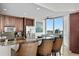 Kitchen with breakfast bar, granite countertops, stainless steel appliances, and city views at 450 Knights Run Ave # 1102, Tampa, FL 33602