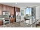 Kitchen island with bar seating, stainless steel appliances, and granite countertops at 450 Knights Run Ave # 1102, Tampa, FL 33602