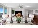 Living area with unique decor, a glass-top table, and a view of the city at 450 Knights Run Ave # 1102, Tampa, FL 33602