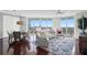 Open living and dining area with large windows, city views, and hardwood floors at 450 Knights Run Ave # 1102, Tampa, FL 33602