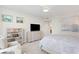 Inviting main bedroom with a cozy sitting area, dresser, and wall-mounted TV at 450 Knights Run Ave # 1102, Tampa, FL 33602