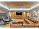 Comfortable media room with leather furniture and large TV at 450 Knights Run Ave # 1102, Tampa, FL 33602