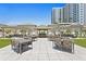 Outdoor kitchen and dining area with artificial turf at 450 Knights Run Ave # 1102, Tampa, FL 33602