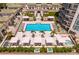 Relaxing pool area with ample seating, hot tub, and lush landscaping at 450 Knights Run Ave # 1102, Tampa, FL 33602