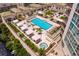Spectacular pool area with loungers, hot tub, and lush landscaping at 450 Knights Run Ave # 1102, Tampa, FL 33602