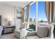 A sitting area with plush chairs and large windows offering stunning city views at 450 Knights Run Ave # 1102, Tampa, FL 33602