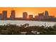 Sunset view over the bay and waterfront with city skyline silhouette at 450 Knights Run Ave # 1102, Tampa, FL 33602