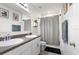 Bathroom featuring double sinks, a walk-in shower and modern fixtures at 5193 Deltona Blvd, Spring Hill, FL 34606