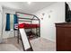 Playful bedroom featuring a bunk bed with a slide and bright, cheerful decor at 5193 Deltona Blvd, Spring Hill, FL 34606