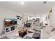 Spacious living area with a view of the modern kitchen and dining space at 5193 Deltona Blvd, Spring Hill, FL 34606